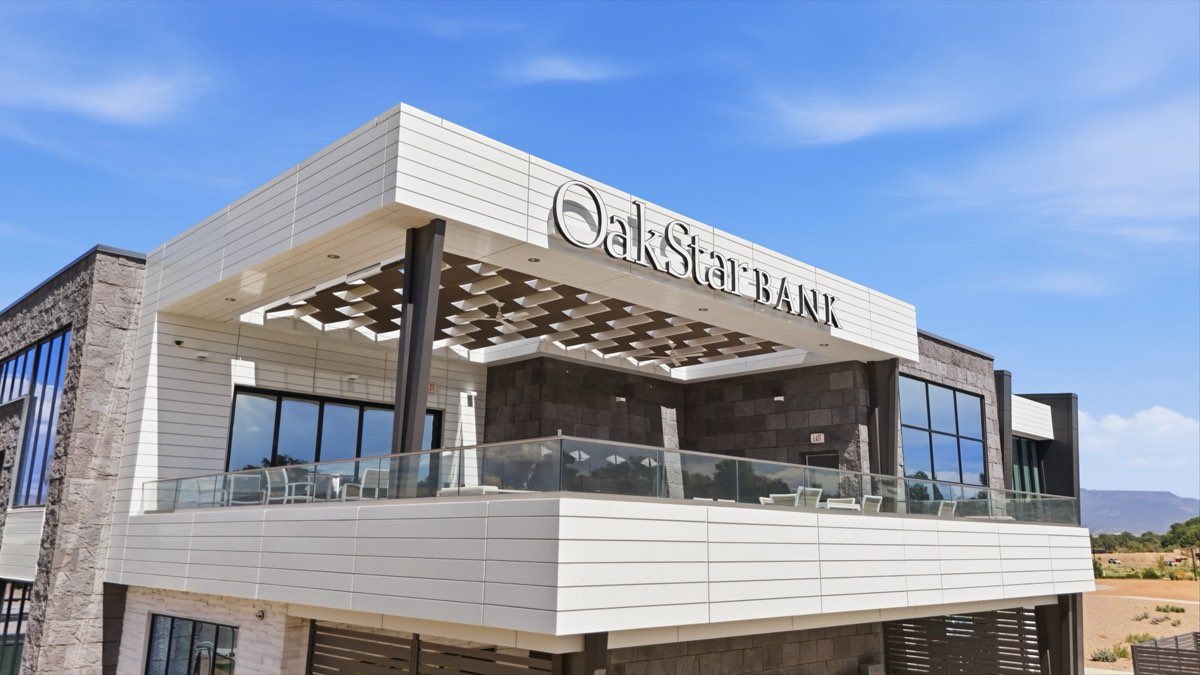 OakStar Bank building with a fabric shade lattice under the roof overhang above its rooftop patio